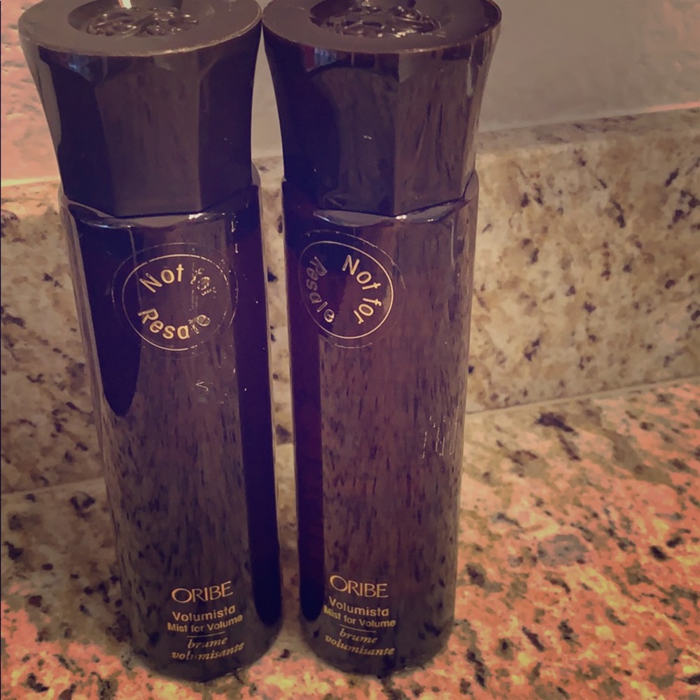 Two bottles of Oribe Volumista volumizing mist